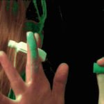 fingers with green paint